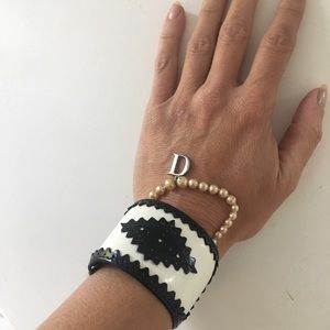 Christian Dior black and white cuff bracelet.